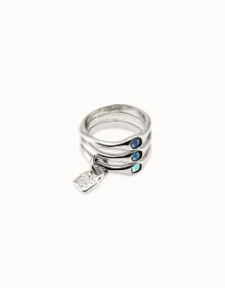 Anillo triple bañado en plata de ley con cristales azules.