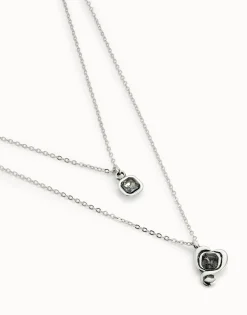 Colgante bañado en plata de ley con doble cadena y corazones con cristal negro