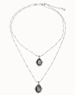 Collar doble bañado en plata con dos cristales facetados ovalados negros