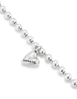 Pulsera bañada en plata de ley con bolas y charm de corazón