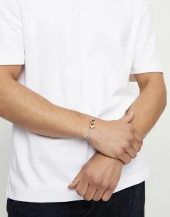 Pulsera de cuero azul con mosquetón entrelazado en oro