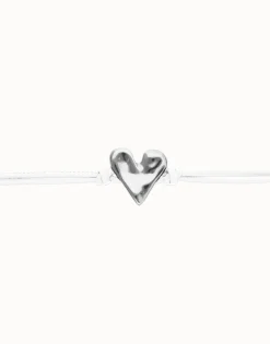 Pulsera de cuero blanco con detalle de corazón bañado en plata de ley