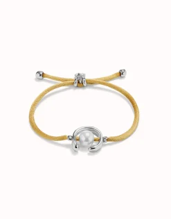 Pulsera de hilo camel con perla shell fornitura bañada en plata de ley.