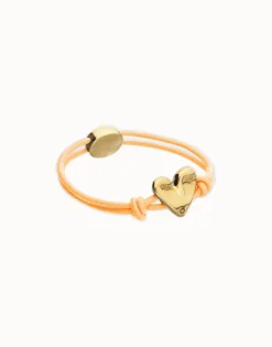 Pulsera de hilo elástico naranja con corazón bañado en oro 18k