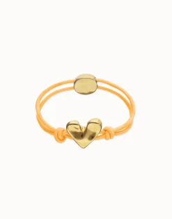 Pulsera de hilo elástico naranja con corazón bañado en oro 18k
