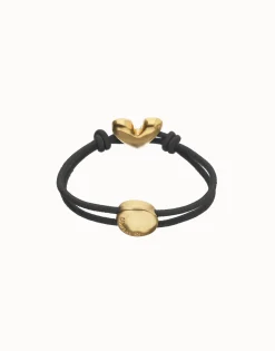 Pulsera de hilo elástico negro con corazón bañado en oro 18k