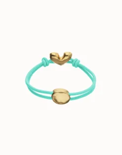 Pulsera de hilo elástico turquesa con corazón bañado en oro 18k