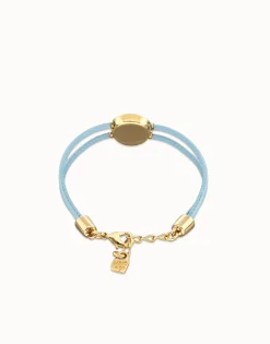 Pulsera doble de cuero celeste con ojo bañado en oro 18k