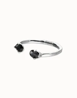 Pulsera rígida bañada en plata con dos cristales facetados ovalados negros