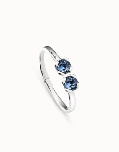 Pulsera rígida bañada en plata de ley, con muelle interior y dos cristales azules